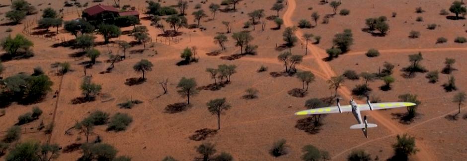 Multirotor drone capturing aerial imagery over construction site